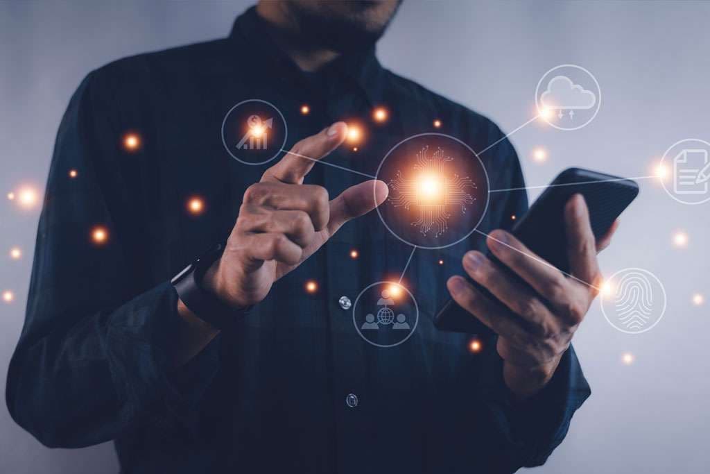 A person using a phone with digital icons for data, cloud and collaboration