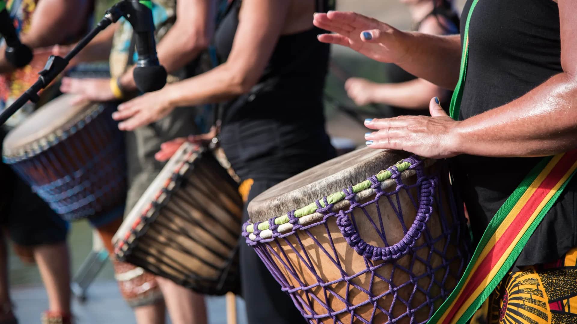 Why do most L&D programmes fail without anyone noticing?. Several people playing djembe drums side by side